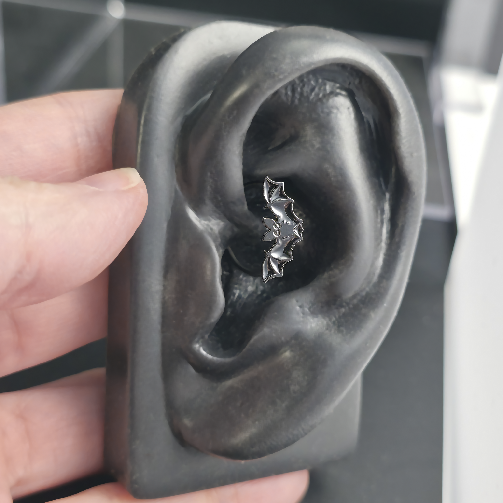 black halloween bat daith earring in ear