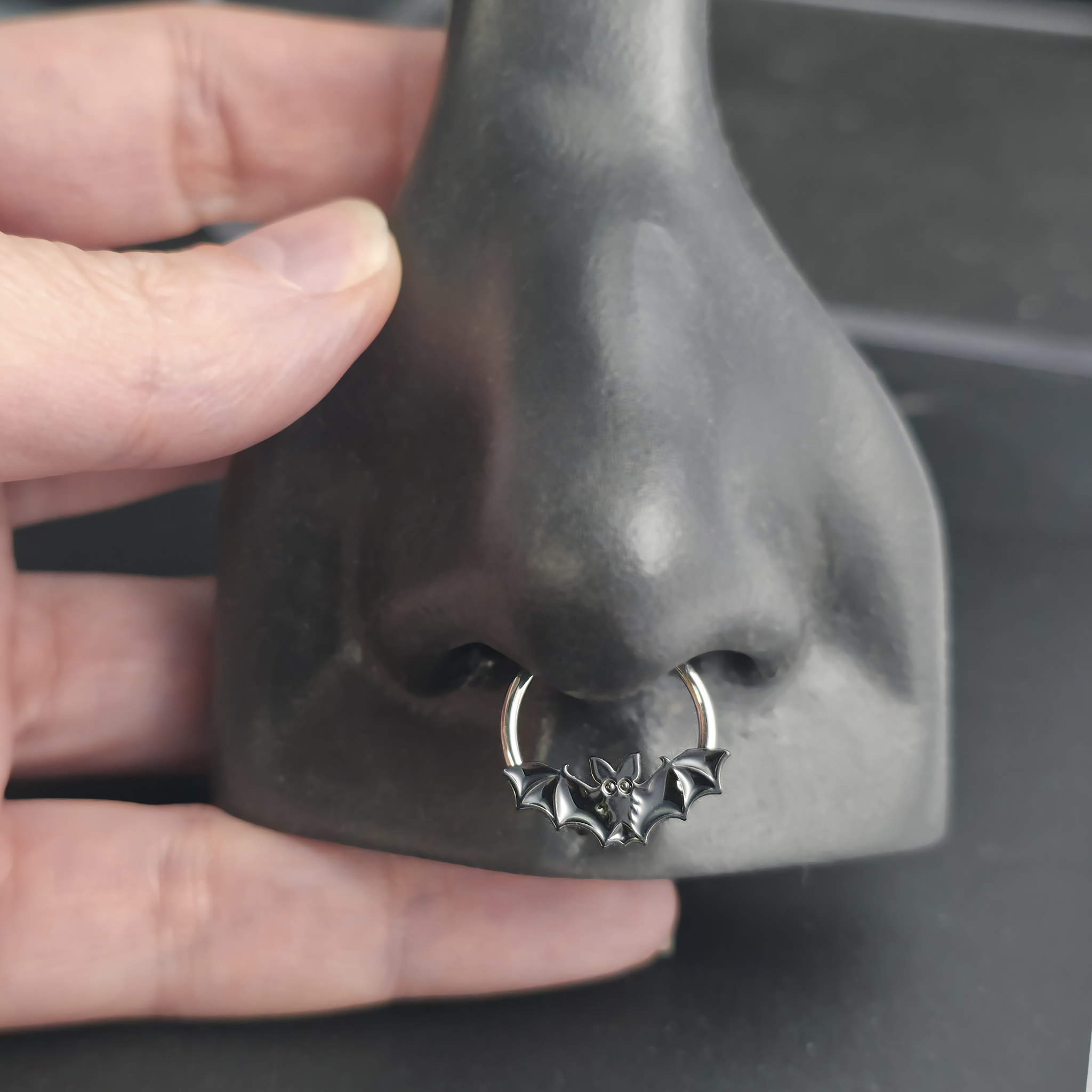 black halloween bat septum ring in nose