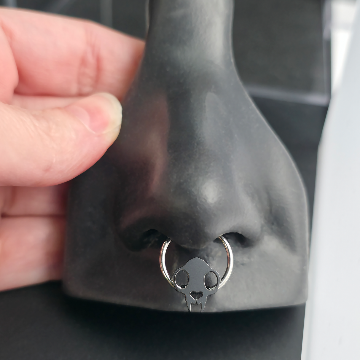 cat skull septum ring in nose