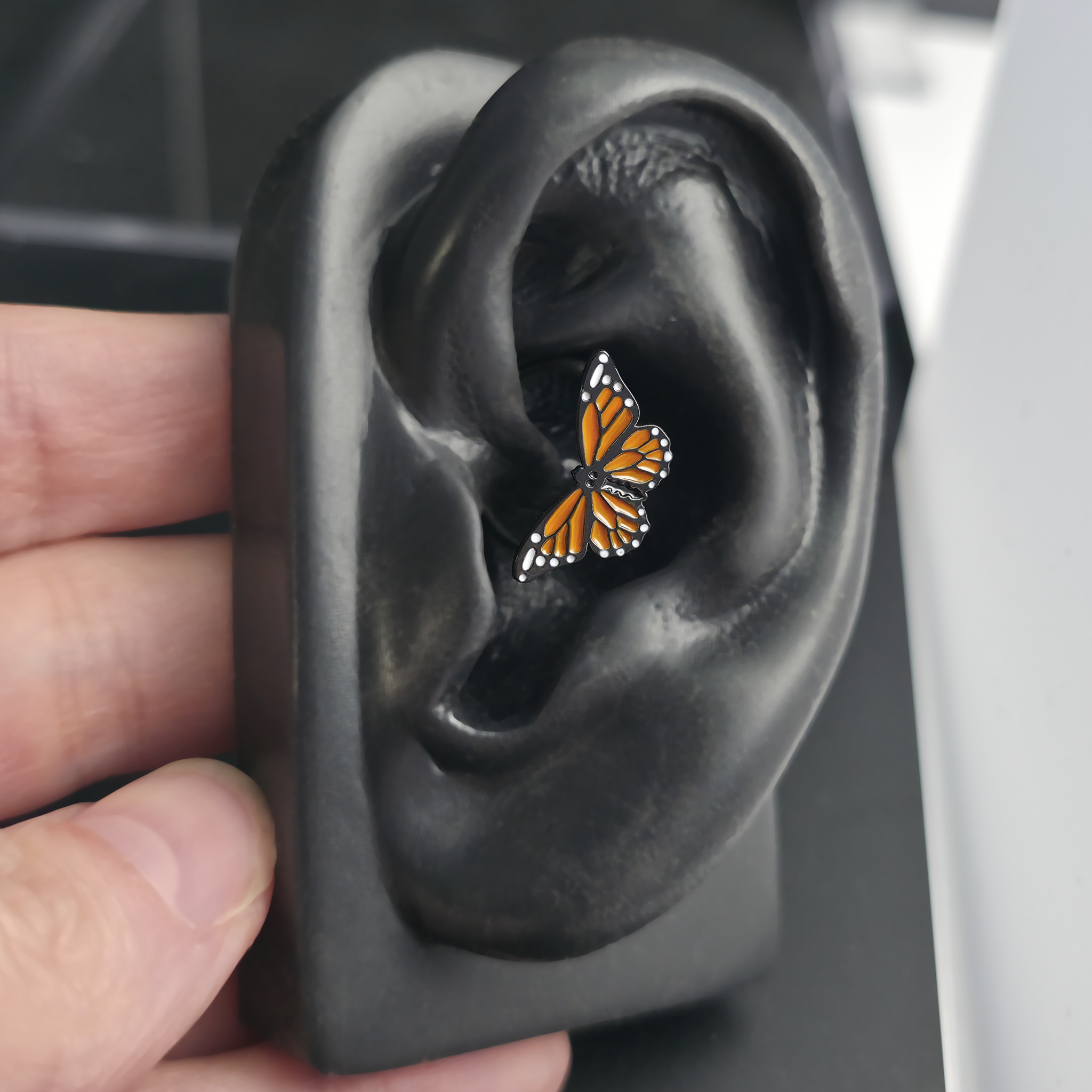 monarch butterfly daith earring in ear