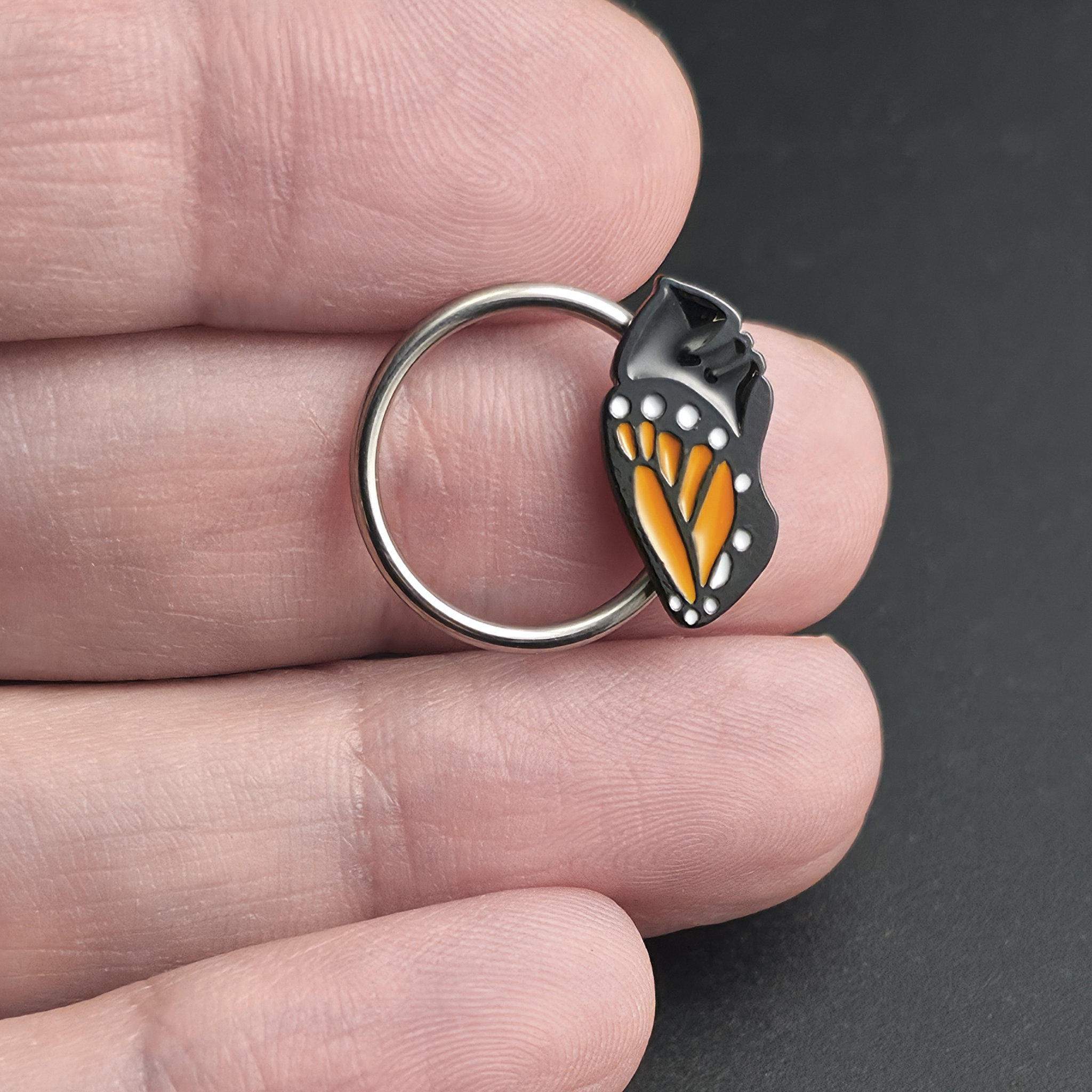 monarch chrysalis captive bead ring on hand