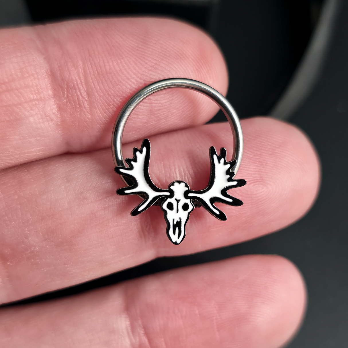 moose skull captive bead ring on hand