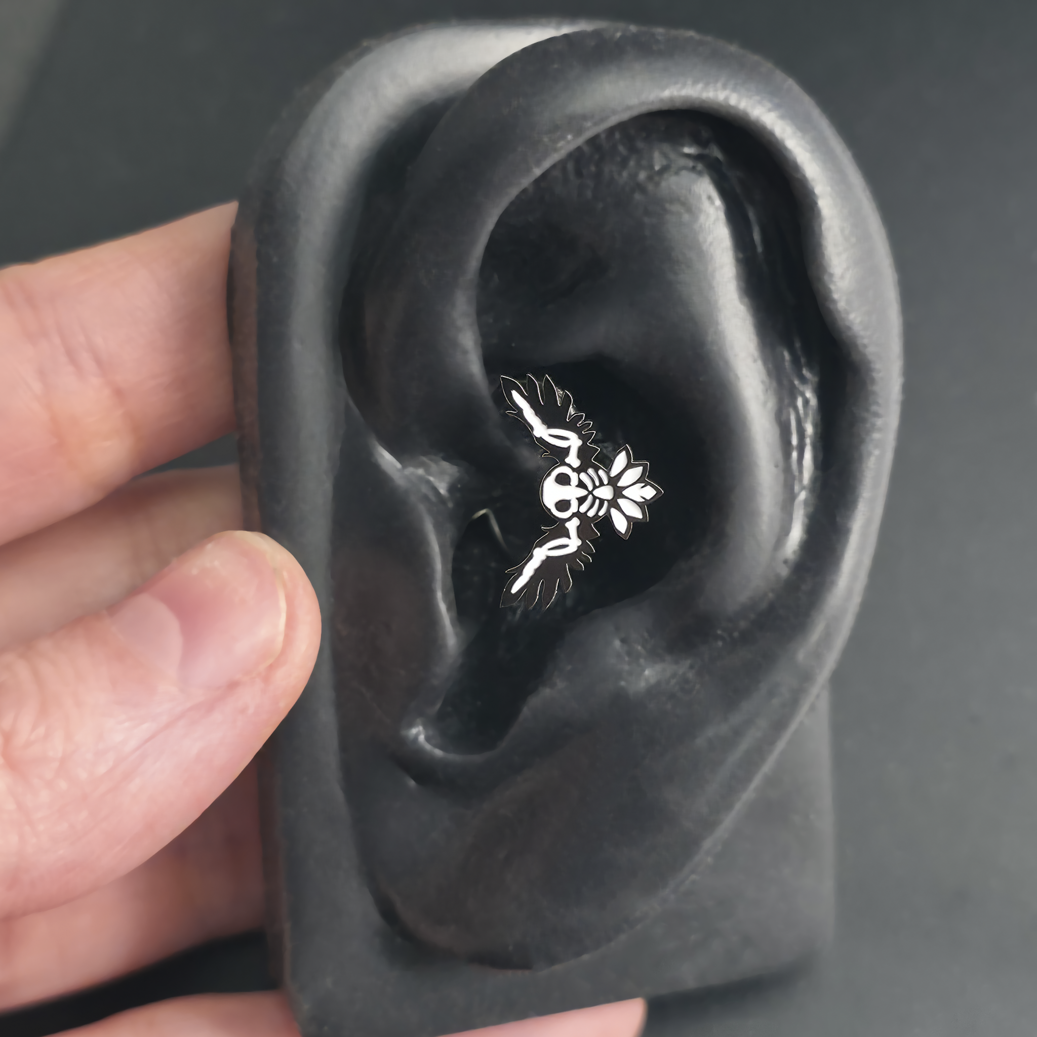 owl skeleton daith earring in ear