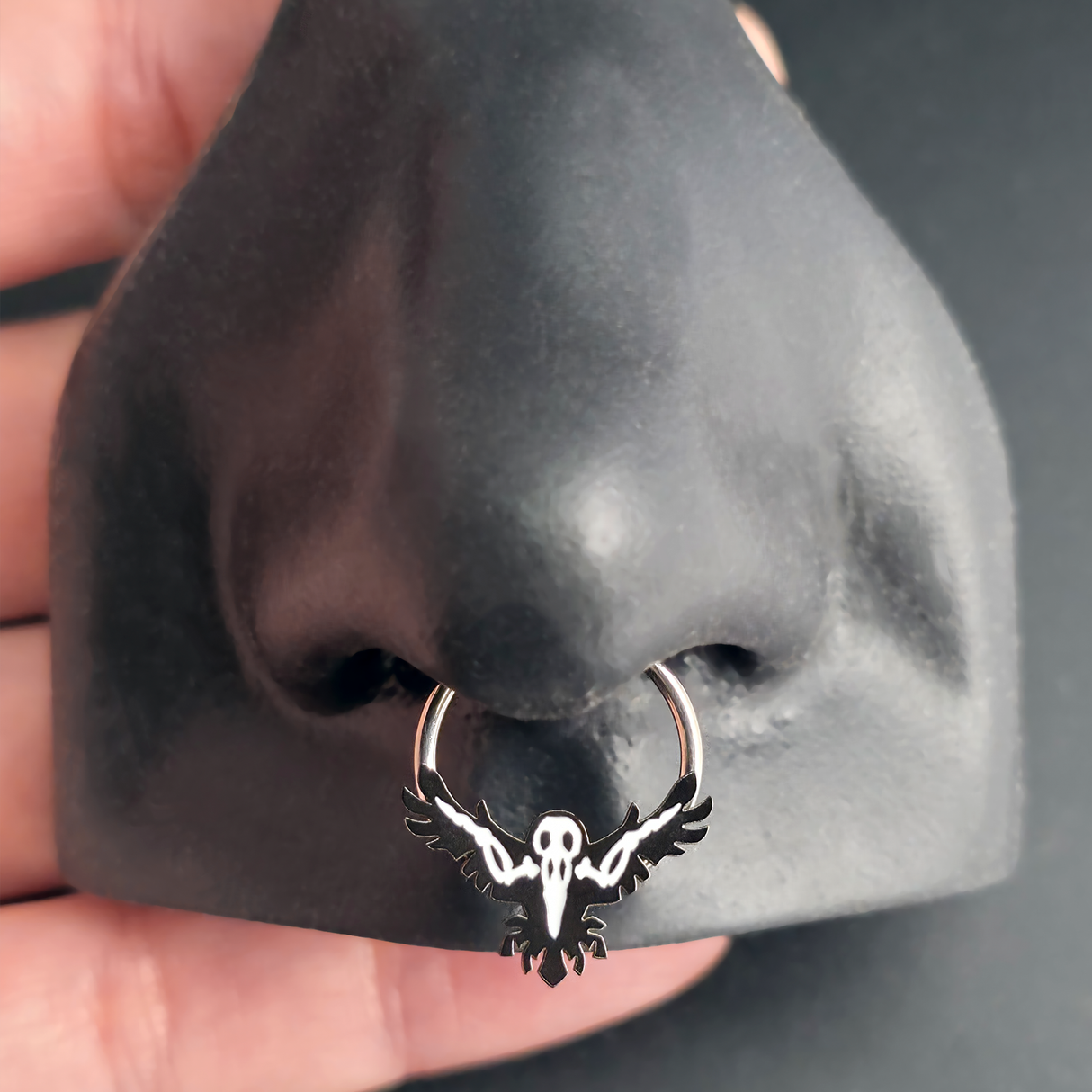 raven skeleton septum ring in nose