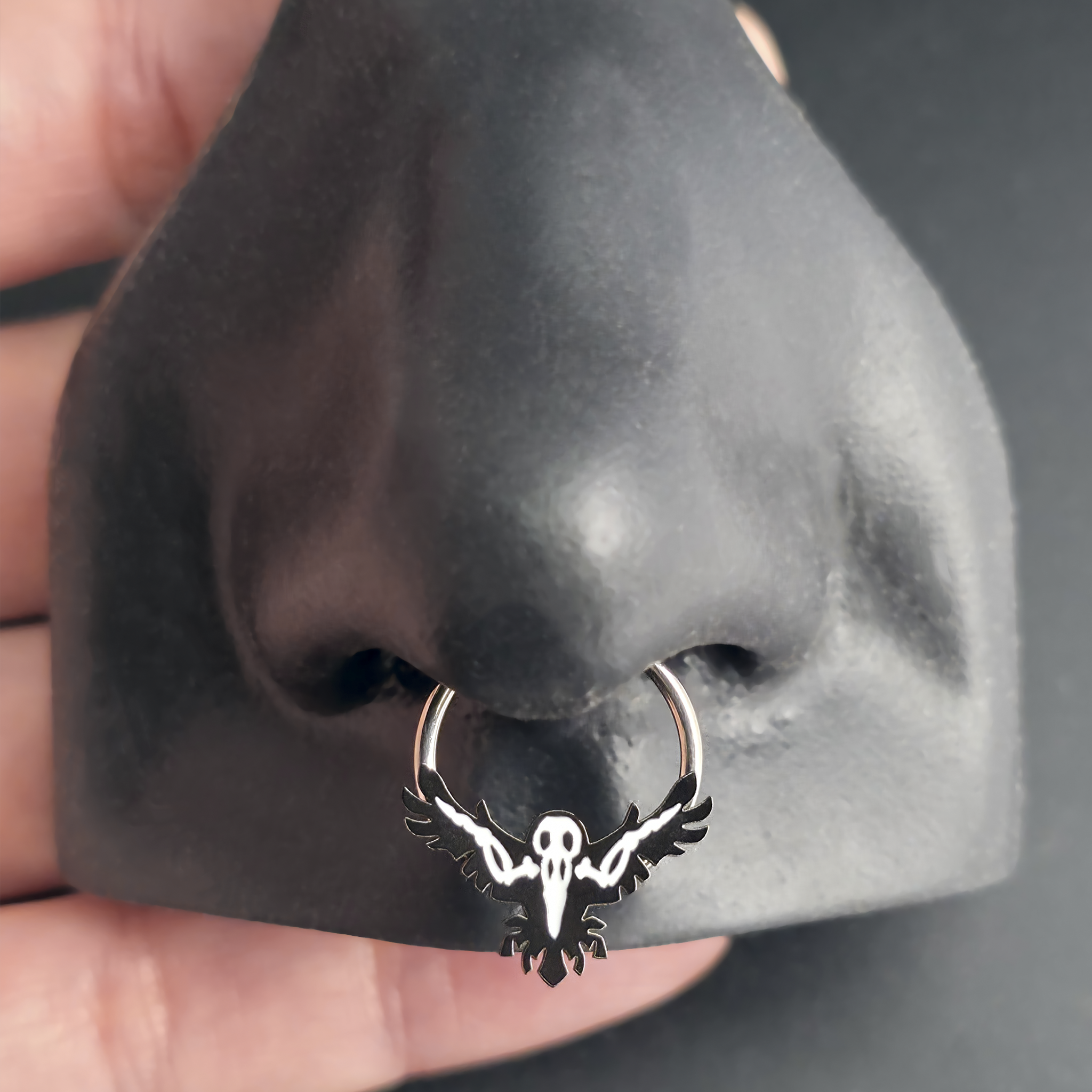 raven skeleton septum ring in nose