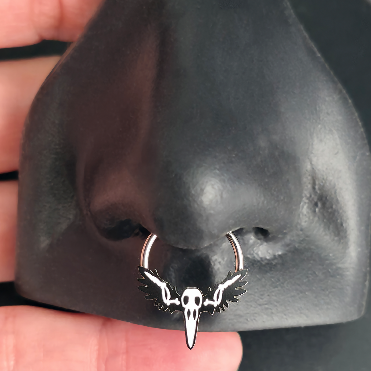 raven skull septum ring in nose