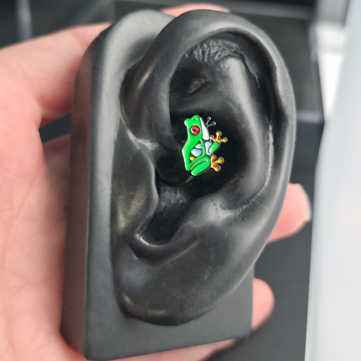 red eyed tree frog daith earring in ear