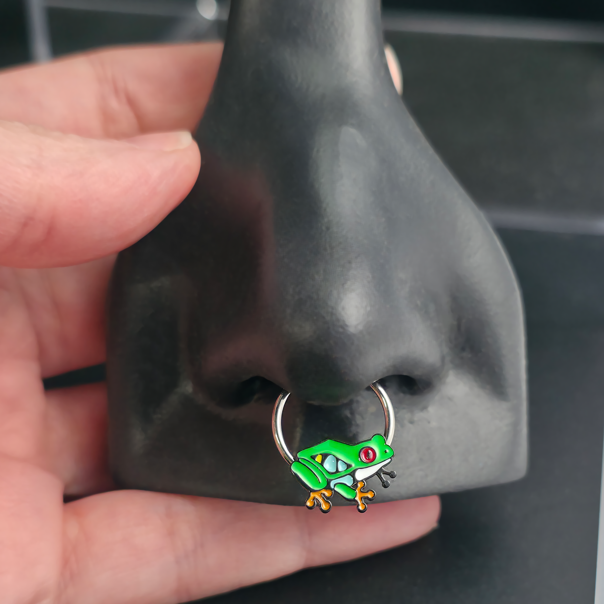 red eyed tree frog septum ring in nose