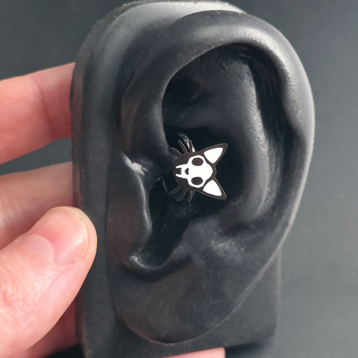 cat skull daith earring in ear