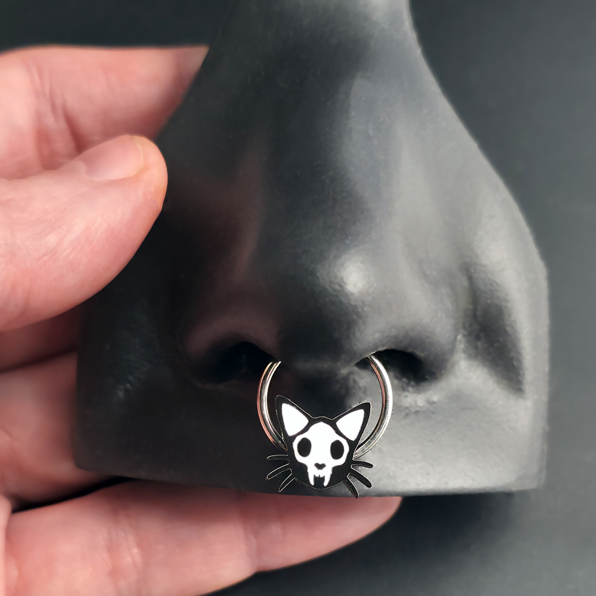 cat skull septum ring in nose