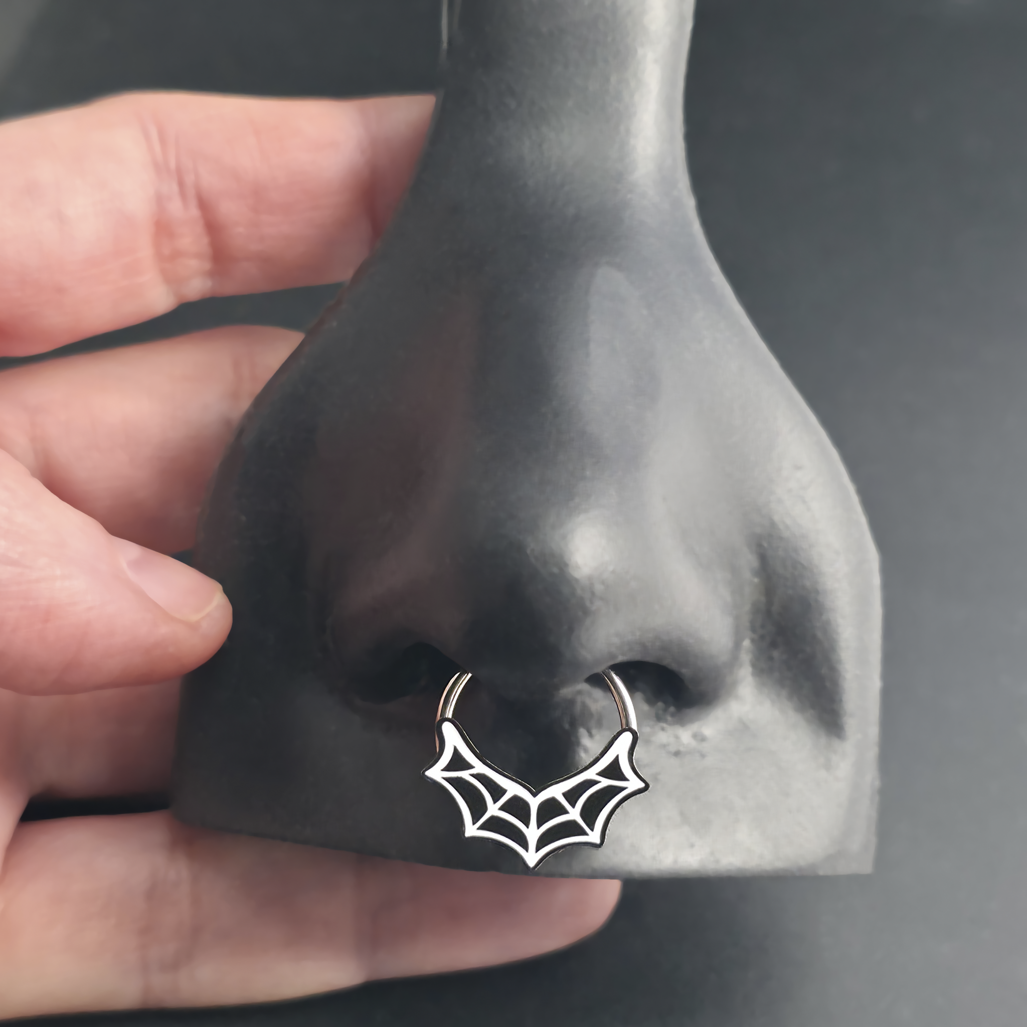 spiderweb septum ring in nose