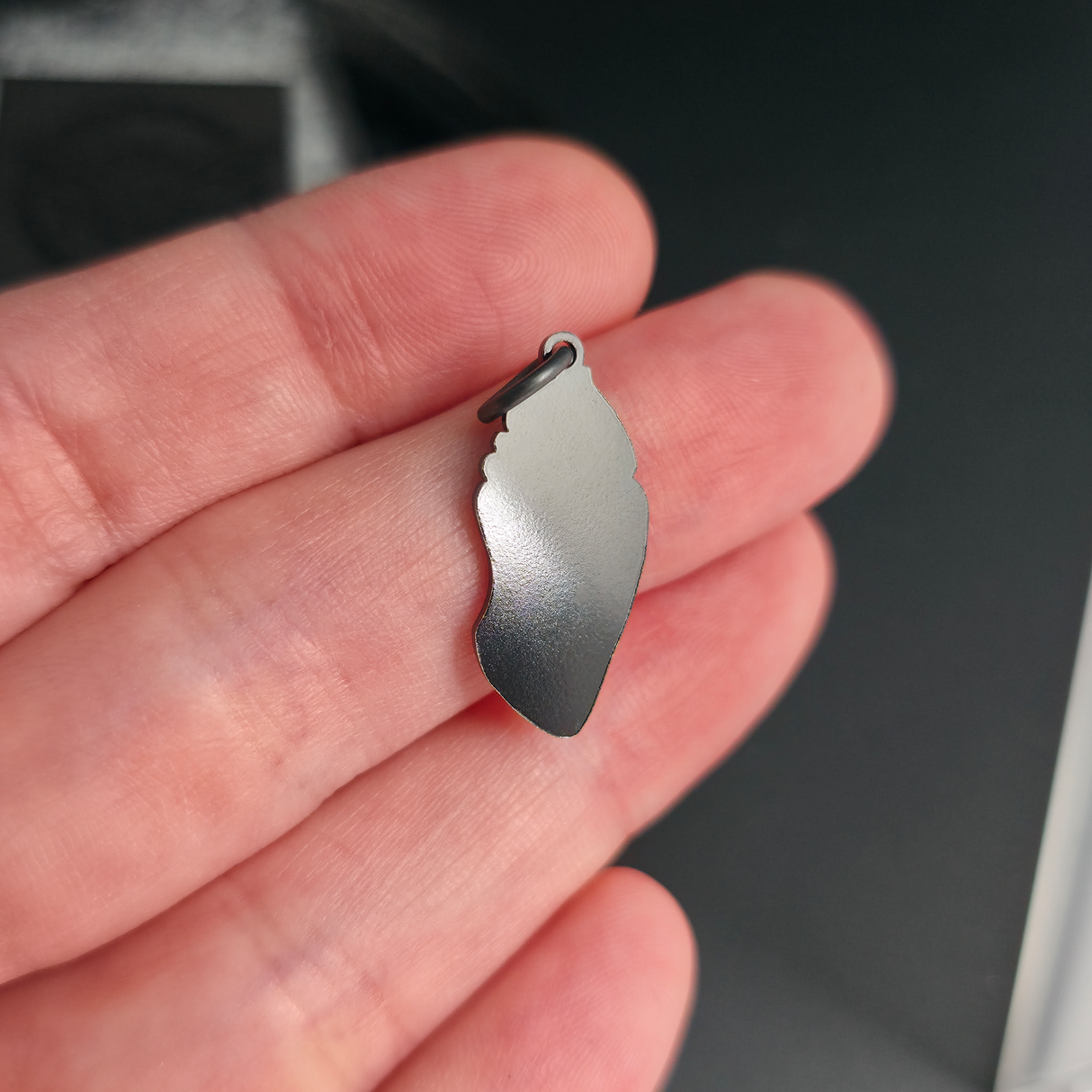 back side of monarch chrysalis necklace pendant