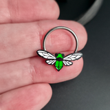 green cicada captive bead ring on hand