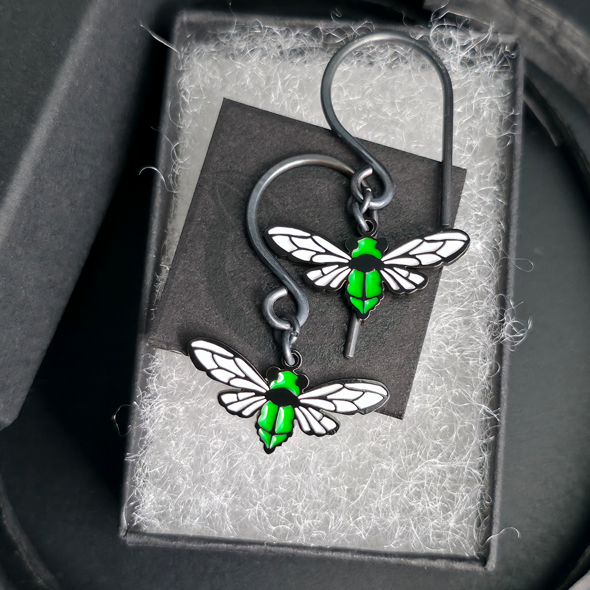 cicada dangle earrings in jewelry box