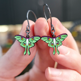 luna moth dangle earrings in hand