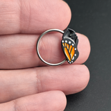 monarch chrysalis captive bead ring on hand