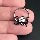 skull octopus septum ring on hand