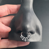 spiderweb septum ring in nose
